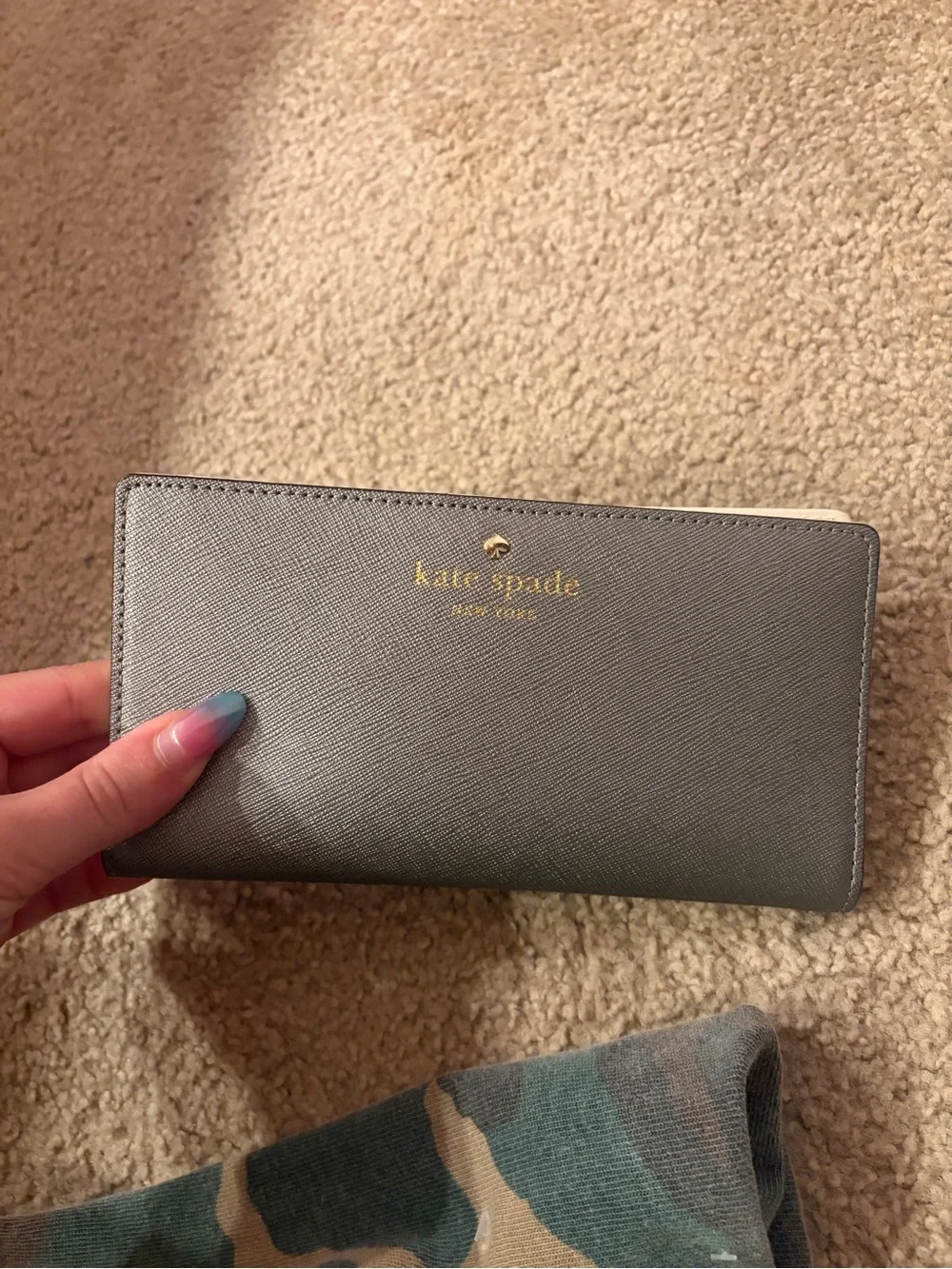 kate spade gray card holder with gold logo